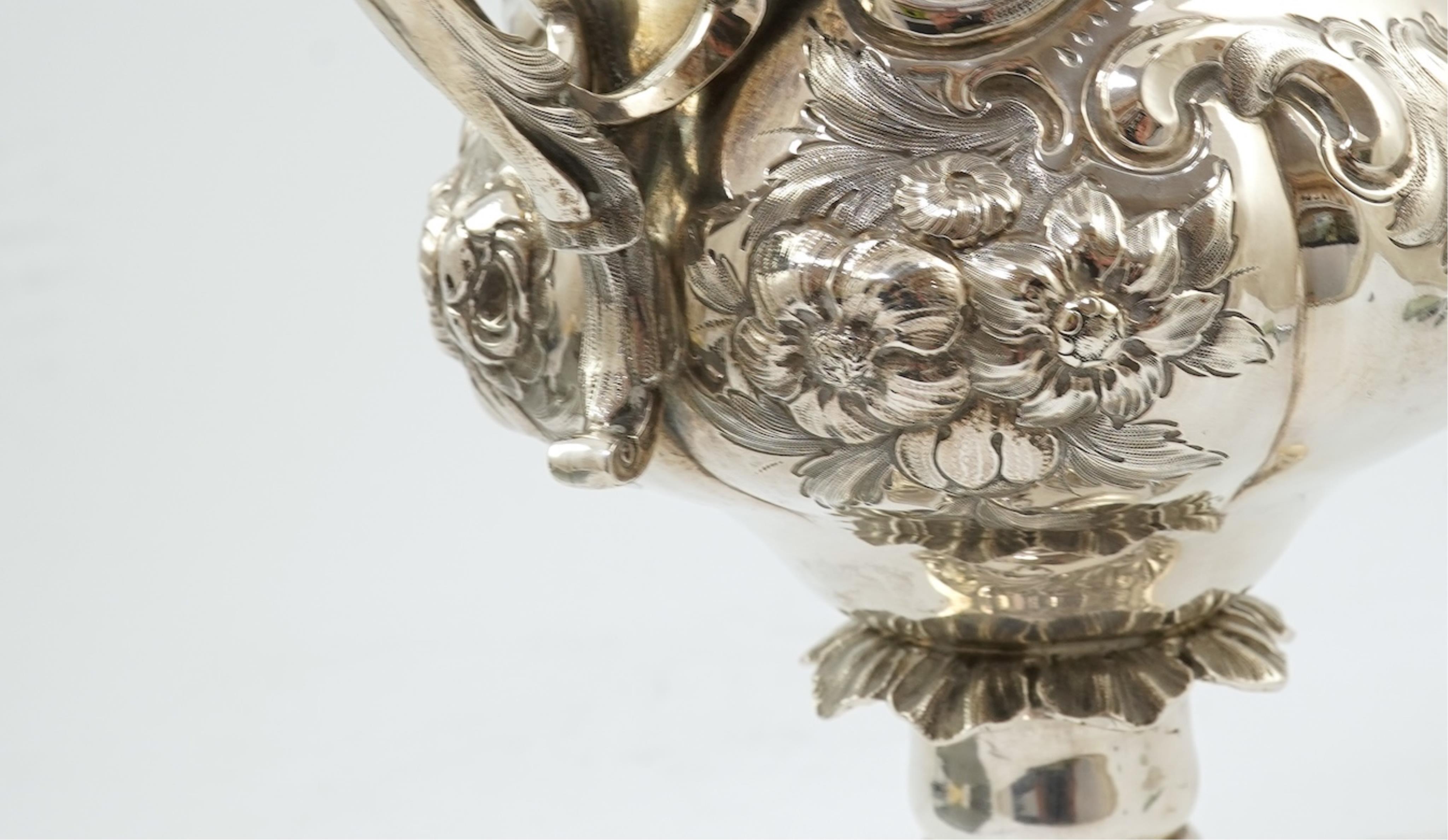 A Victorian embossed silver two handled presentation trophy cup by George John Richards & Edward Charles Brown